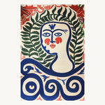 A vibrant and contemporary Area Rug featuring an abstract design with a face surrounded by lush green leaves and bold blue swirls. Perfect for adding artistic flair to a dining room or bedroom, this wool rug offers a unique touch to bedroom area rugs.