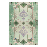 Ethereal Verde Hand Tufted Area Rug in soft greens and purples, perfect for enhancing a living room. This wool rug is designed with intricate geometric patterns, offering a stylish touch to any space. Ideal for large living room areas, this area rug combines elegance and functionality.