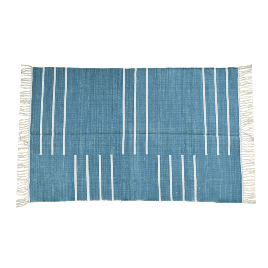 Elevate your space with the timeless charm of the "Handwoven Denim Blue and White Minimalistic Cotton Rug with Fringes." Its clean lines and minimalist design in denim blue and white hues exude modern sophistication, while the fringes add a touch of texture and whimsy. Handcrafted with care, this rug brings both style and comfort to any room in your home.