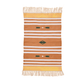 Add a pop of color to your space with this handwoven orange and white patterned cotton rug. Its vibrant hues and intricate design bring energy and style to any room. Finished with fringes for a playful accent, this rug is both charming and durable, enhancing your home decor effortlessly.