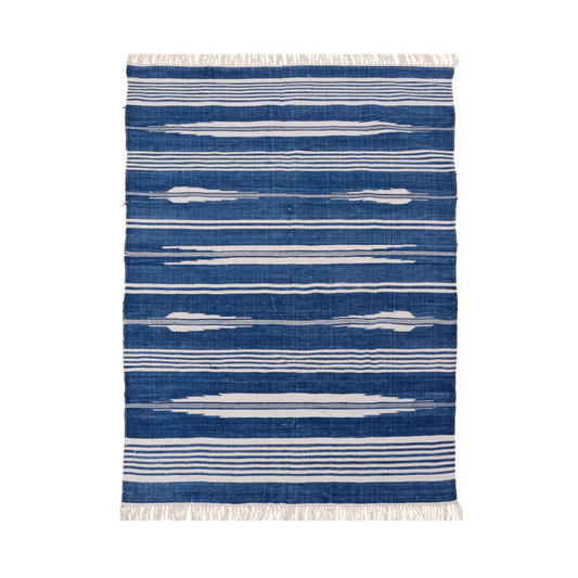 Infuse coastal charm into your space with this handwoven blue and white stripe patterned cotton rug. Its timeless design evokes a sense of relaxation, while fringes add a touch of elegance. Durable and soft, this rug effortlessly enhances your home decor.