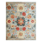 This Classic Charm Hand Tufted Rug features an intricate floral pattern in vibrant red, orange, and blue tones on a soft, elegant background. Ideal for adding a touch of sophistication to your office or dining room, this wool area rug combines style and comfort, making it a perfect choice for office rugs or rugs for office settings.