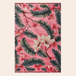 A vibrant Blushing Garden Hand Tufted Area Rug featuring a pink floral design with lush green leaves, perfect for adding a touch of elegance to an office or living room. This wool rug is ideal for those seeking stylish area rugs for living room decor.
