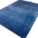 Top view of the Blue Arctic Geo Modern Hand Tufted Wool Rug, perfect for a living room or dining room. This luxurious 8 x 10 ft area rug features a geometric pattern that adds a contemporary touch to any space, making it an ideal choice for those seeking high-quality wool rugs for living room or dining room area rugs.