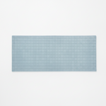 Rectangular blue tufted wool rug on a white background