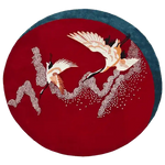 The "Crimson Flight Hand Tufted Round Rug" features a stunning red design, offering elegance, softness, and timeless beauty to any space.