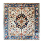 Elegant hand-tufted area rug with intricate patterns, perfect for adding a touch of cultural essence to your office. The wool rug features a central medallion design with rich blue and cream tones, ideal for office rugs or any space seeking a sophisticated touch.