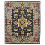 Vibrant hand-tufted area rug featuring a rich mix of colors and intricate patterns, perfect for enhancing a living room or dining room. This wool rug showcases a traditional design that's ideal as a dining table rug centerpiece.
