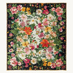 The Eden Blossom Hand Tufted Rug showcases a vibrant floral design, perfect for adding a pop of color to your living room. This wool area rug features intricate, colorful flowers against a dark background, ideal for large living room spaces. Its plush texture and exquisite detailing make it a standout piece among large area rugs.