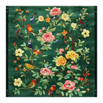 The Emerald Oasis Hand Tufted Area Rug features a vibrant floral design with colorful birds on a rich green background. This elegant wool rug is perfect for adding a touch of nature to your living room or dining room, making it an ideal choice for those seeking stylish living room and dining room rugs or dining room carpets.