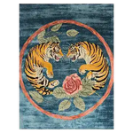Stunning hand tufted area rug featuring an abstract design with two tigers face-to-face, surrounded by floral accents, set against a rich blue background. Perfect as a vintage rug for adding elegance to your living room. This wool rug combines artistry and functionality, making it a standout piece among area rugs for living room decor.