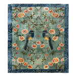 The Feathered Melody Hand-Tufted Rug showcases a stunning design with vibrant birds and floral patterns against a serene background. Ideal for large living room rugs or dining room decor, this wool rug adds elegance to any living room area.