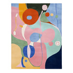 A vibrant abstract meadow dance hand-tufted area rug featuring bold and colorful shapes in shades of pink, orange, blue, and green. This contemporary rug, made from high-quality wool, is perfect for adding a splash of color to your living room.