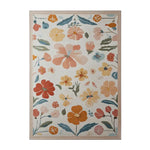 Top view of the Blooming Vortex Hand Tufted Wool Area Rug featuring a vibrant floral pattern with colorful flowers in shades of orange, yellow, and blue on a light background.