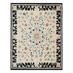 The Blossom Frame Hand Tufted Wool Rug features an intricate floral design with a central medallion surrounded by delicate flowers and leaves. The area rug is crafted in soft hues of green, orange, and blue on a cream background, bordered by a striking black frame adorned with floral patterns. This elegant and stylish rug brings a touch of nature-inspired beauty to any room.