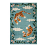 Vibrant area rug featuring an abstract design with two tigers amidst a backdrop of swirling clouds and floral accents on a teal background. The hand-tufted wool rug brings a touch of elegance and wildlife art to any room.