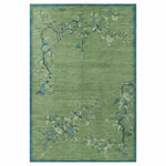 Green floral patterned rug on a white background
