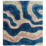 A vibrant area rug featuring an abstract design with flowing contours in shades of blue, pink, and beige, resembling topographical lines for a modern, artistic look.