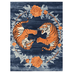 The 'Dance of the Wild Hand Tufted Rug' features an abstract design with two vibrant orange tigers encircled by intricate floral patterns on a deep blue background. Perfect as an area rug, it brings a touch of vintage charm to large living rooms, ideally sized at 8x10 feet. This wool rug combines elements of a floral rug with the boldness of a vintage rug, offering a unique centerpiece for your home decor.