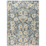 Area rug featuring a serene floral design with cream and beige blossoms set against a soft blue background. The hand-tufted wool rug exudes an Eastern tranquility, perfect for adding a touch of elegance to any room.