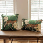Elegant green leopard-print throw pillows showcasing vibrant jungle motifs, perfect for adding a touch of nature-inspired decor to any living space.