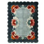 This elegant area rug, perfect for living room spaces, showcases a beautiful floral design with vibrant red, orange, and teal flowers on a soft grey background. The hand-tufted wool construction adds a luxurious feel, making it a standout piece among living room rugs sized 8x10. Ideal for those seeking a floral rug that combines style and comfort.