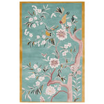 Floral Whispers Sky Hand Tufted Rug showcasing an elegant design with delicate floral patterns and birds on a serene blue background. This area rug is perfect for adding a touch of nature to large living room spaces, enhancing the aesthetic with its exquisite wool craftsmanship.