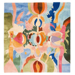 A vibrant, contemporary square area rug featuring an abstract design with colorful, organic shapes in shades of blue, pink, orange, and green. This wool rug is perfect for adding a pop of color to large living rooms, measuring 8x10 feet, and offers a modern touch to any space.