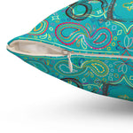 Colorful throw pillow featuring a vibrant paisley pattern, ideal for adding a tropical touch to your decor.