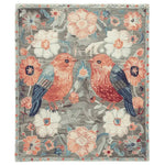 Beautiful area rug titled 'Garden of Song Whispers Hand Tufted Rug' featuring a charming floral design with birds, perfect for adding warmth and elegance to any living room. This wool rug showcases vibrant colors and intricate details, making it an ideal choice for those seeking stylish living room area rugs with a floral theme.