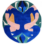 The Garden Spirit Fold hand-tufted area rug features a bold, abstract design with vibrant blues, pinks, and greens. Perfect for adding a contemporary touch to your space, this wool rug is ideal for living rooms. Its unique, round shape makes it a standout piece among living room rugs, especially in an 8x10 layout.