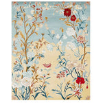 The Gilded Bloom Breeze Hand Tufted Area Rug features a vibrant floral design with intricate patterns in red, blue, and gold hues. Perfect as a wool rug, it adds elegance to large living room spaces.