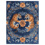 This hand-tufted area rug features a striking design with two majestic tigers surrounded by intricate floral patterns in vibrant orange and deep blue tones. Perfect as a floral rug for living rooms, this vintage-inspired wool rug adds elegance and style to any space. Ideal for those seeking unique area rugs for living room decor.