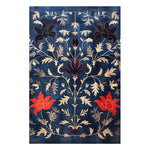 Indigo Garden Hand Tufted Area Rug featuring an intricate floral design in vibrant red and beige on a deep blue background. Perfect for adding a touch of vintage elegance to your dining room. This wool rug is ideal for formal dining room settings, enhancing the space with its classic charm and stylish pattern.