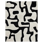 Contemporary Line Language Pop Hand Tufted Area Rug featuring a bold black and white abstract pattern, perfect for modern living rooms. This wool rug adds a stylish touch to any space, making it an ideal choice for those seeking unique area rugs for living room decor.
