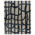 Top view of the Lined in Thought Hand Tufted Area Rug, featuring an abstract design with bold navy blue lines against a neutral beige background. This contemporary wool rug is perfect for large living rooms, adding a modern touch to your space.
