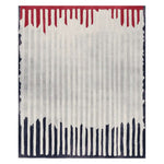 A contemporary area rug featuring a hand-tufted design with vertical lines in shades of red, white, and blue. This wool rug is perfect for adding a modern touch to living room spaces, offering both style and comfort.