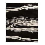A stylish hand-tufted area rug featuring a modern abstract design with black and white wavy patterns. This contemporary wool rug is ideal for enhancing living room spaces, available in an 8x10 size, providing both elegance and comfort.