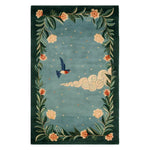 A beautiful area rug featuring a hand-tufted wool design, perfect for large living rooms. This floral rug showcases intricate patterns with a central motif of a bird in flight surrounded by lush foliage and delicate flowers. Ideal as an area rug for living room spaces, it combines elegance with the durability of a wool rug.