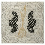 Area rug with a contemporary design featuring an abstract pattern resembling zebra stripes and flowing lines in black and beige tones. This hand tufted wool rug adds a touch of modern elegance to any living room, ideal for those seeking unique area rugs for living room decor.