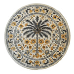 Elegant Oasis Reverie Hand Tufted Wool Rug featuring a round design with intricate floral patterns and a central palm motif. Perfect for enhancing large living rooms, this wool rug offers a touch of nature with its detailed design, making it an ideal choice for those seeking unique living room area rugs.