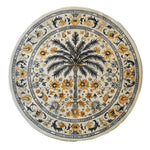 Elegant Oasis Reverie Hand Tufted Wool Rug featuring a round design with intricate floral patterns and a central palm motif. Perfect for enhancing large living rooms, this wool rug offers a touch of nature with its detailed design, making it an ideal choice for those seeking unique living room area rugs.