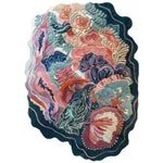 The Ocean Blossom Hand Tufted Rug features a stunning floral design with vibrant colors. Crafted with precision, it adds elegance, warmth, and a calming atmosphere to any space.