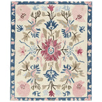 A beautifully crafted ornate flora fringe hand-tufted area rug, showcasing an intricate floral design with vibrant pink, blue, and beige hues. Perfect for adding elegance to living room area rugs. This wool rug is ideal for those seeking large living room rugs with a touch of nature-inspired charm.