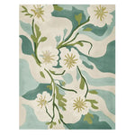 Floral patterned rug with white flowers and green leaves on a teal and beige background