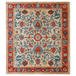Elegant Persian Bloom hand-tufted wool area rug featuring intricate floral patterns in vibrant red, blue, and beige hues. Ideal for enhancing the decor of large living rooms, this 8x10 rug adds a touch of classic charm.