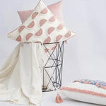 Decorative throw pillow featuring pink leopard embroidery, perfect for adding a stylish touch to any home decor.