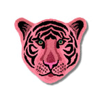 A vibrant Pink Tiger Face Hand-Tufted Wool Accent Rug, perfect for a contemporary living room. This striking area rug, shaped like a tiger's face, adds a bold statement to large living room spaces. Ideal for those looking for unique living room rugs in 8x10 dimensions, this wool rug combines artistry with comfort.