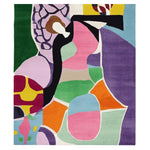A vibrant and colorful area rug featuring an abstract design with bold shapes and colors including purple, pink, green, and orange. This contemporary wool rug is perfect for adding a modern touch to your living room. Ideal as a centerpiece, this 8x10 rug enhances any space with its artistic flair.