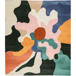 The Radiant Petal Chaos Hand Tufted Rug is a vibrant area rug featuring an abstract floral design with bold colors like pink, orange, blue, and green. This contemporary wool rug is perfect for adding a splash of color to large living rooms, making it an ideal choice for area rugs for living room spaces.